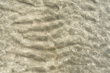 Transparent water surface and sand on the lake bottom