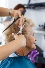 Closeup Of Senior Woman Getting Haircut