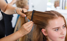 Closeup Of Teen Girl Getting Haircutting