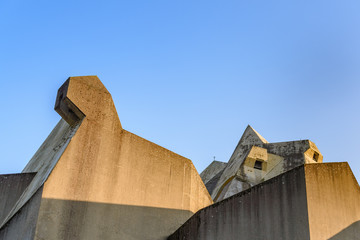 weird, strange and unique shape and form of concrete brutalist architecture at the rooftop. massive 