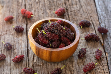Wall Mural - Fresh mulberry fruit on wood table background