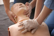 People learning to perform CPR at first aid training course