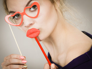 Poster - woman holds carnival accessories on stick