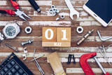 Fototapeta  - 1st May. Happy International Worker's day or Labour Day background concpet.  wooden block calendar 1 May and handy tools and office men's accessories on grunge wooden table texture background.