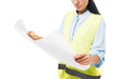 © LIGHTFIELD STUDIOS - Cropped view of concentrated engineer in safety vest looking at blueprint isolated on white