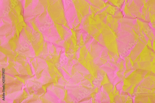 Texture of crumpled paper. Trendy pink golden duotone background.