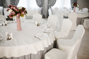 Idea of arranging the holiday table, crystal glasses on white background.