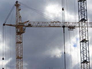 Tower cranes and their parts, construction of a new house.