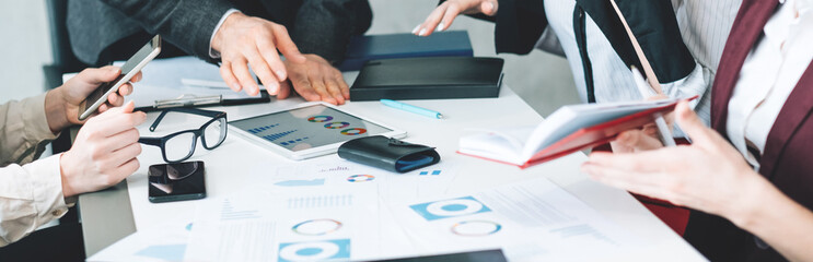 Business team office meeting. Growth rates discussion. Cropped shot of hands and workpspace with graphs and diagram documents