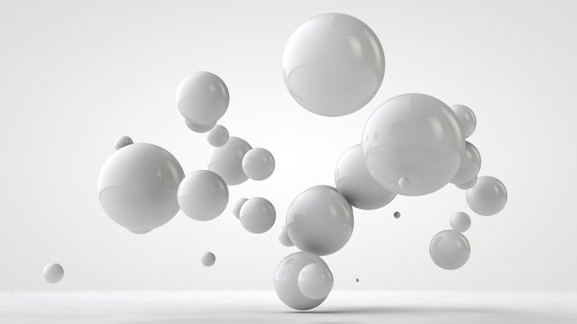 3D illustration of balls of different sizes hanging in space. The idea of order, chaos and harmony. Abstraction. Comparative image of the geometry of space. 3D rendering isolated on white background.