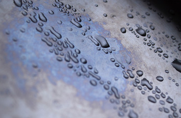 The texture of the metal. Drops on titanium. Retro texture metal, great design for any purposes. Silver steel. Scratched metal texture. Steel plate background. Abstract background. 