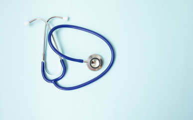 Color stethoscope on blue background. Healthcare.