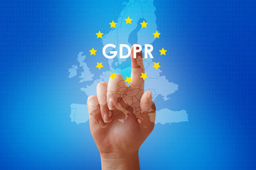 Hand touching the symbol General data protection regulation GDPR on blue background