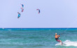 view of kitesurfer in the sea practicing sport a windy day