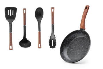 Frying pan wooden handle and a set of four blades, ladle isolate. Kitchen set Gift. Kitchenware