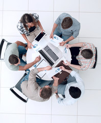 Wall Mural - top view.business team making a financial report