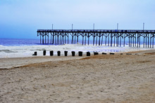 Pier On A Beach With Breaking Waves 