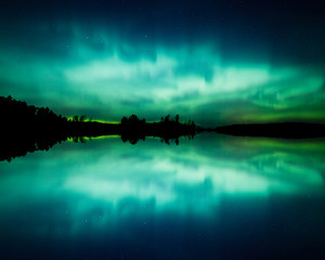 Wall Mural - beautiful northern lights over lake mirrored