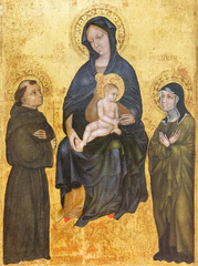 Canvas Print - Pavia, Italy. November 11 2017. The painting of Madonna with the infant Jesus among Saint Francis of Assisi and Saint Clare. End of XIV century. From the convent 