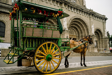 Horse Drawn Carriage parking in front of Malate church , Manila Philippines