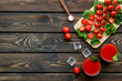 © 9dreamstudio - summer cocktails for freshness with red tomato and ice on wooden background top view space for text