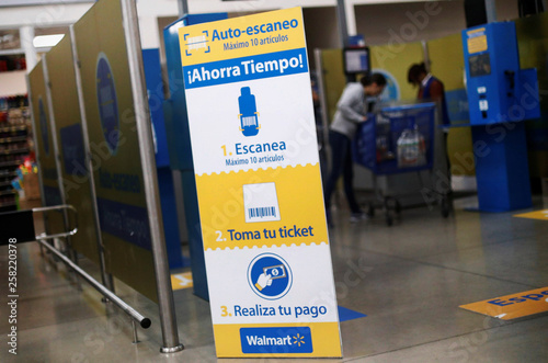 The Self Service Checkout Area Is Pictured Inside A Walmart Store