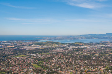 Wall Mural - Aerial view of urban sprawl of Wollongong city in Australia