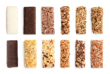 set of different sweet protein bars on white background, top view