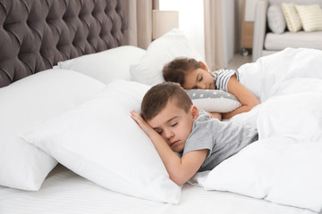 Wall Mural - Cute little children sleeping in comfort bed. Space for text