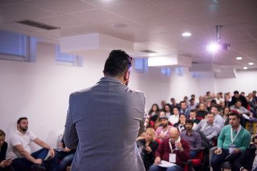 Wall Mural - successful businessman giving presentations at conference room