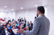 © .shock - successful businessman giving presentations at conference room