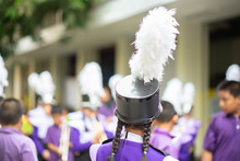 Little Boy In Purple White Uniform Play Saxophone In  Marching Band