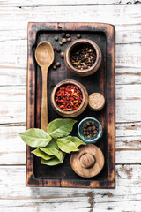 Wall Mural - Spices and herbs on kitchen table