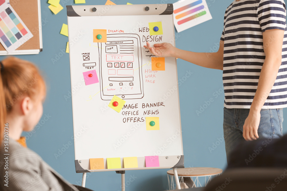 Young IT designers working in office