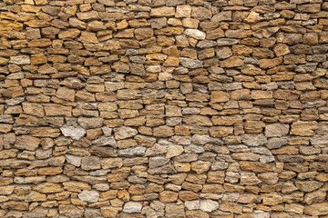 Vintage grunge stone blocks wall texture.