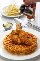 Wall Mural - fried chicken and waffles with maple syrup, american food