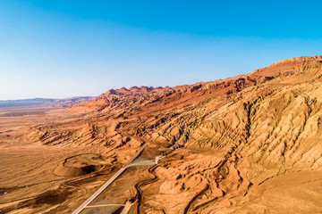 Wall Mural - The Flaming Mountains are barren eroded red sandstone hills in Tian Shan Mountain range Xinjiang China. 