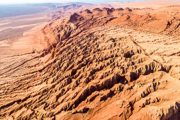 Wall Mural - The Flaming Mountains are barren eroded red sandstone hills in Tian Shan Mountain range Xinjiang China. 