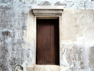 Closed Wooden Window on the White Concrete Wall of the Old Chinese Building