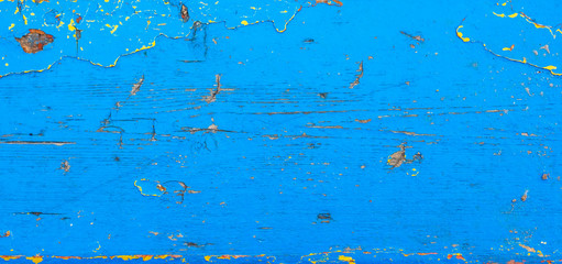 old grunge rustic wooden texture background with blue color cracked weathered paint and scratches