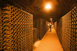 A wine taster in a wine cellar