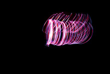 Light Painting Of Continuous Red And White Spirals Forming A Double Vortex Like Figure. Dynamic Time Trajectory Of Two Lights Simultaneously.