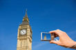 Personal perspective of a tourist photographing Big Ben with a digital camera. london. england.