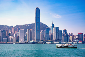 Passenger ship on Hong Kong island background.