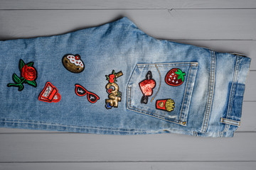 jeans embellished with embroidered patches