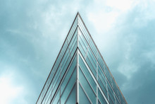Triangle Shaped Structure Against A Blue Cloudy Sky.