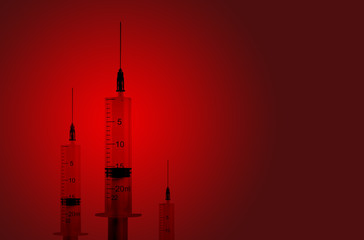 Syringes on a red background. The concept of drug addiction and danger of infection.