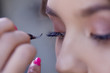 © Ulia Koltyrina - Eyelash extension. Beautiful brunette girl in a beauty salon