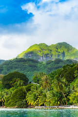 View of the mountain landscape in the lagoon Huahine, French Polynesia. Vertical.