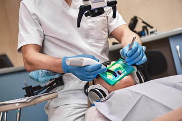 Creating the healthy smile through science and artistry. Dental treatment using the Rubber Dam system